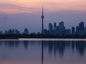 Preview wallpaper city, buildings, lake, water, reflection, dusk