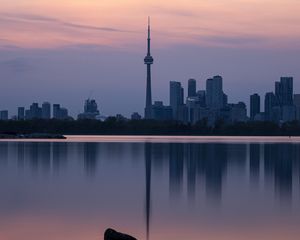 Preview wallpaper city, buildings, lake, water, reflection, dusk