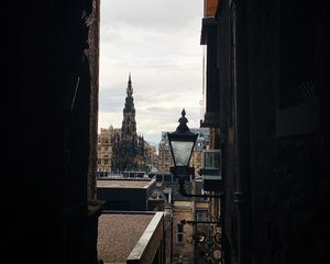 Preview wallpaper city, buildings, lantern, arch, dark
