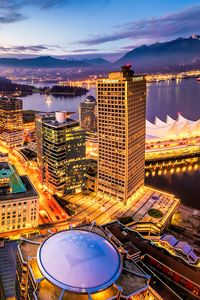 Preview wallpaper city, buildings, lights, sea, aerial view