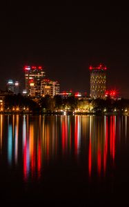 Preview wallpaper city, buildings, lights, glow, reflection