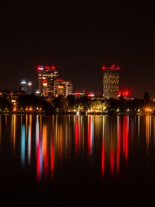 Preview wallpaper city, buildings, lights, glow, reflection