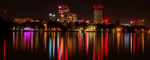 Preview wallpaper city, buildings, lights, glow, reflection