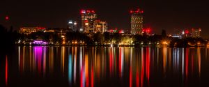 Preview wallpaper city, buildings, lights, glow, reflection