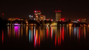 Preview wallpaper city, buildings, lights, glow, reflection