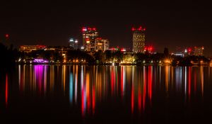 Preview wallpaper city, buildings, lights, glow, reflection
