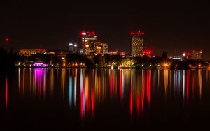 Preview wallpaper city, buildings, lights, glow, reflection