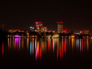 Preview wallpaper city, buildings, lights, glow, reflection