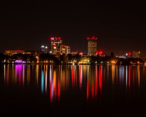 Preview wallpaper city, buildings, lights, glow, reflection