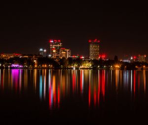 Preview wallpaper city, buildings, lights, glow, reflection