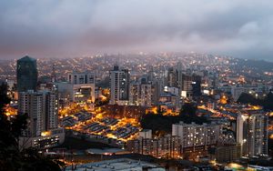 Preview wallpaper city, buildings, lights, fog, twilight