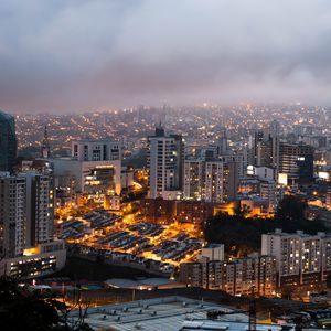 Preview wallpaper city, buildings, lights, fog, twilight