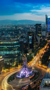 Preview wallpaper city, buildings, lights, road, twilight, aerial view