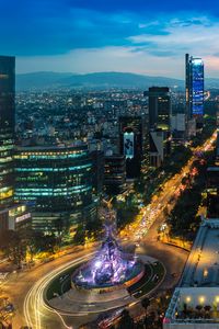 Preview wallpaper city, buildings, lights, road, twilight, aerial view