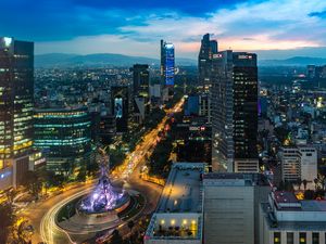 Preview wallpaper city, buildings, lights, road, twilight, aerial view