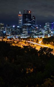 Preview wallpaper city, buildings, lights, road, metropolis, twilight