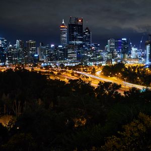 Preview wallpaper city, buildings, lights, road, metropolis, twilight