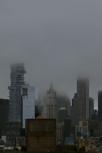 Preview wallpaper city, buildings, metropolis, fog, haze