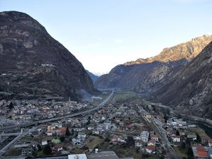 Preview wallpaper city, buildings, mountains, rocks, gorge, shadow