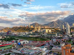 Preview wallpaper city, buildings, mountains, roads