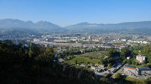 Preview wallpaper city, buildings, mountains, trees, aerial view