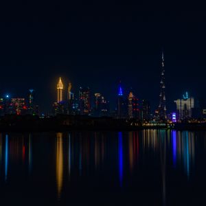 Preview wallpaper city, buildings, night, coast, water, reflection, dark