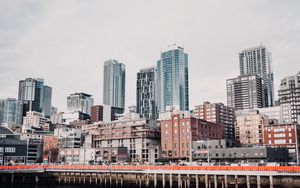 Preview wallpaper city, buildings, pier, water