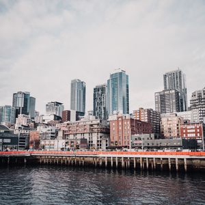 Preview wallpaper city, buildings, pier, water
