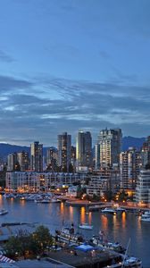 Preview wallpaper city, buildings, pier, water, twilight