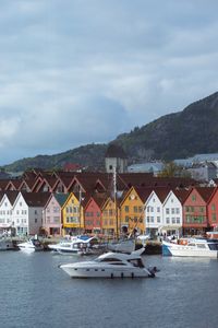 Preview wallpaper city, buildings, pier, boats, water