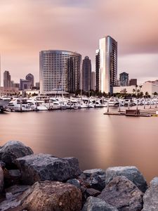 Preview wallpaper city, buildings, pier, boats, water, twilight