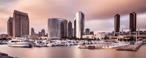 Preview wallpaper city, buildings, pier, boats, water, twilight