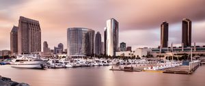 Preview wallpaper city, buildings, pier, boats, water, twilight