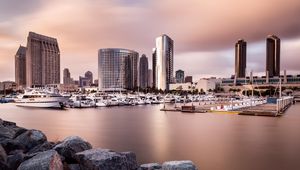 Preview wallpaper city, buildings, pier, boats, water, twilight