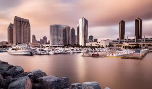 Preview wallpaper city, buildings, pier, boats, water, twilight