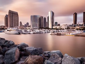 Preview wallpaper city, buildings, pier, boats, water, twilight