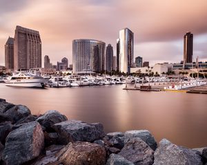 Preview wallpaper city, buildings, pier, boats, water, twilight