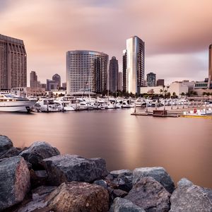 Preview wallpaper city, buildings, pier, boats, water, twilight