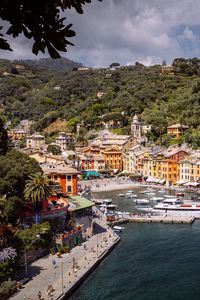 Preview wallpaper city, buildings, pier, boats, water, aerial view