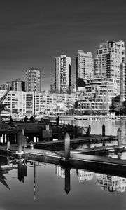 Preview wallpaper city, buildings, pier, black and white