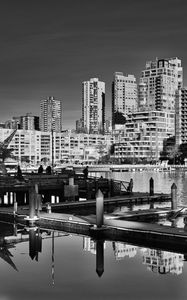 Preview wallpaper city, buildings, pier, black and white