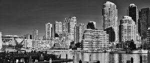 Preview wallpaper city, buildings, pier, black and white