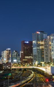 Preview wallpaper city, buildings, railroad, twilight