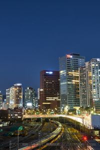 Preview wallpaper city, buildings, railroad, twilight