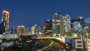 Preview wallpaper city, buildings, railroad, twilight