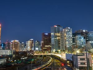 Preview wallpaper city, buildings, railroad, twilight