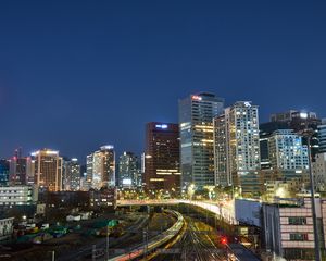 Preview wallpaper city, buildings, railroad, twilight