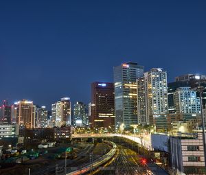 Preview wallpaper city, buildings, railroad, twilight