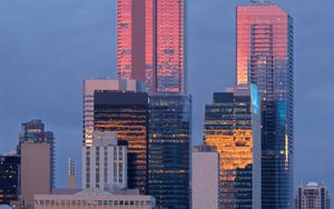 Preview wallpaper city, buildings, reflection, twilight