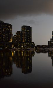Preview wallpaper city, buildings, reflection, water, twilight